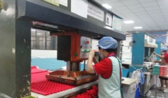 Die-cutting components on the factory floor