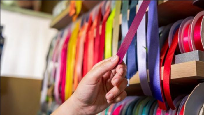 Selecting ribbon trims from a wall display